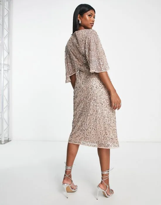 https://images.styletyx.com/images/bridesmaid-delicate-sequin-wrap-midi-dress-in-muted-blush-maya-13027382_2.webp