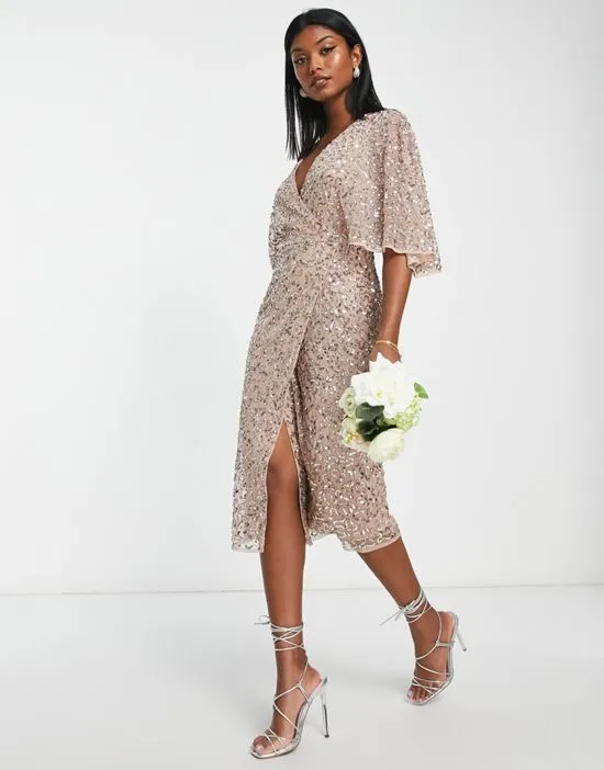 https://images.styletyx.com/images/bridesmaid-delicate-sequin-wrap-midi-dress-in-muted-blush-maya-13027382_4.webp