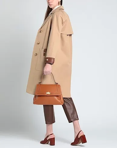 https://images.styletyx.com/images/brown-handbag-signs-1006317642_3.webp