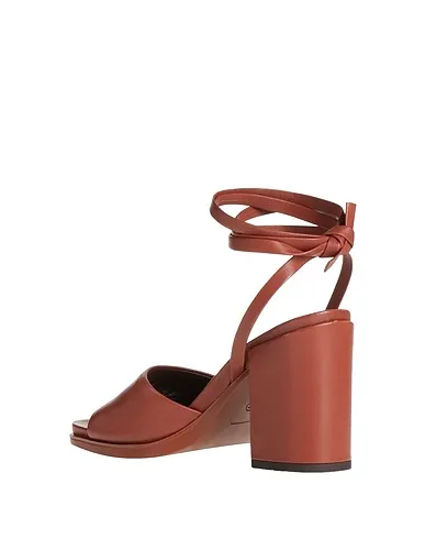 https://images.styletyx.com/images/brown-leather-sandals-hazy-13246256_3.webp