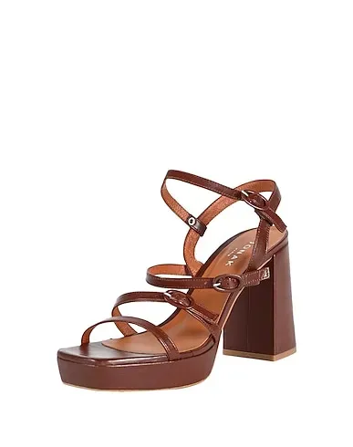 https://images.styletyx.com/images/brown-leather-sandals-jonak-824100477_2.webp