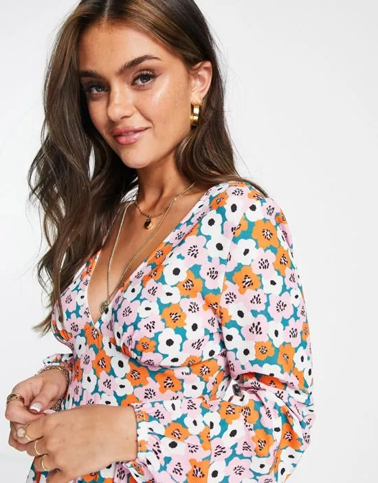 https://images.styletyx.com/images/bubble-crepe-button-back-long-sleeve-jumpsuit-in-floral-print-asos-design-2256821_3.webp