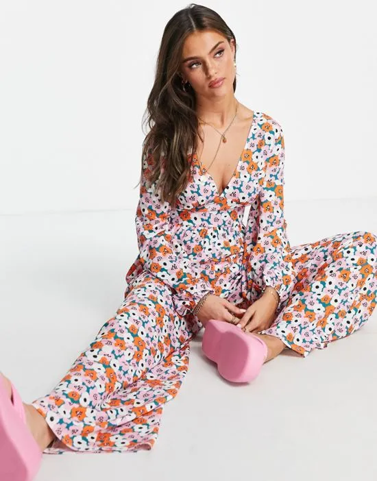 https://images.styletyx.com/images/bubble-crepe-button-back-long-sleeve-jumpsuit-in-floral-print-asos-design-2256821_4.webp