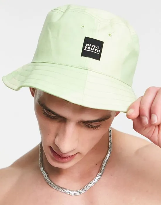 https://images.styletyx.com/images/bucket-hat-and-swim-shorts-in-green-checkerboard-part-of-a-set-native-youth-1886014_2.webp