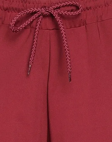 https://images.styletyx.com/images/burgundy-jersey-cropped-pants-culottes-starter-2940998_4.webp