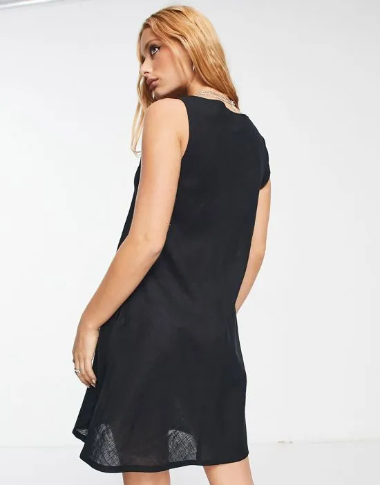 https://images.styletyx.com/images/button-down-mini-dress-in-black-bolongaro-trevor-13274358_2.webp