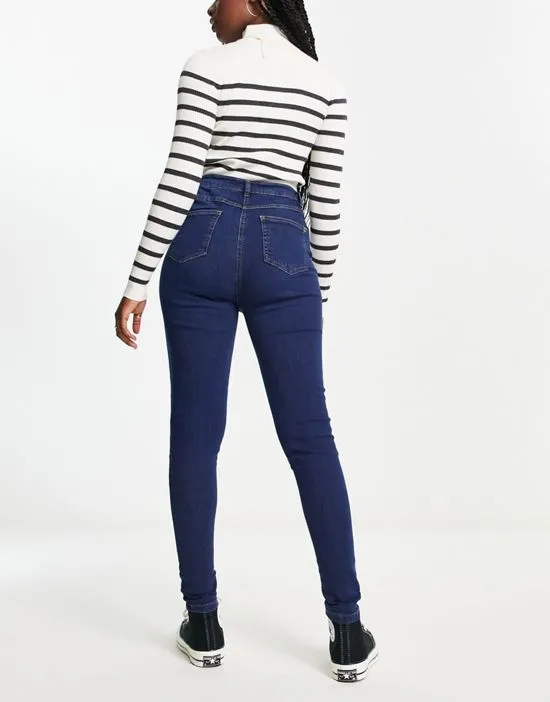 https://images.styletyx.com/images/button-up-skinny-jeans-in-indigo-parisian-13285853_2.webp