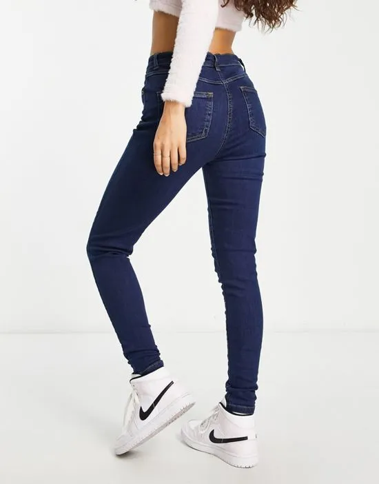 https://images.styletyx.com/images/button-up-skinny-jeans-in-indigo-parisian-petite-13285864_2.webp