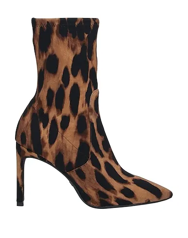 https://images.styletyx.com/images/camel-jersey-ankle-boot-stuart-weitzman-665106_1.webp