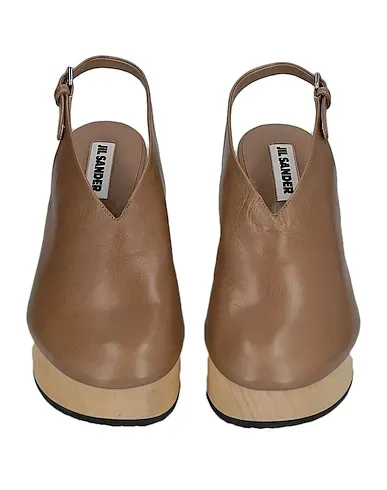 https://images.styletyx.com/images/camel-leather-mules-and-clogs-jil-sander-1198043_4.webp