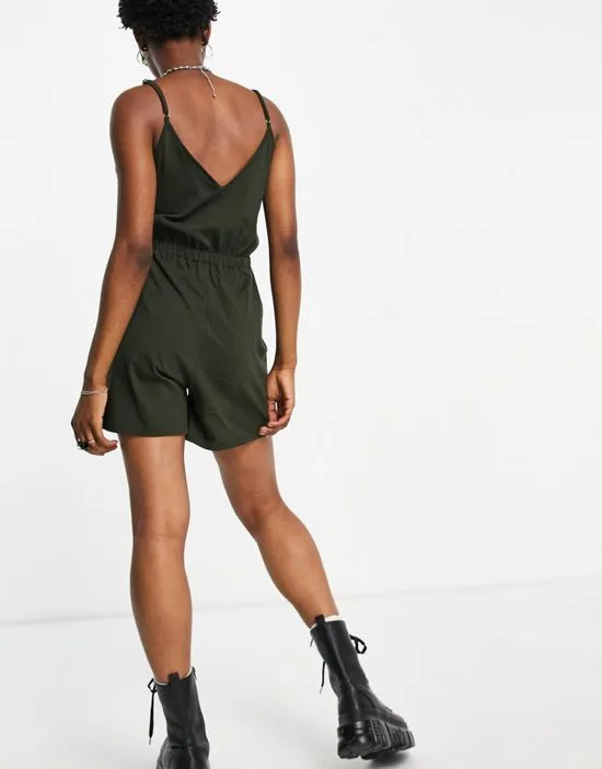https://images.styletyx.com/images/cami-romper-in-dark-green-noisy-may-1741109_2.webp