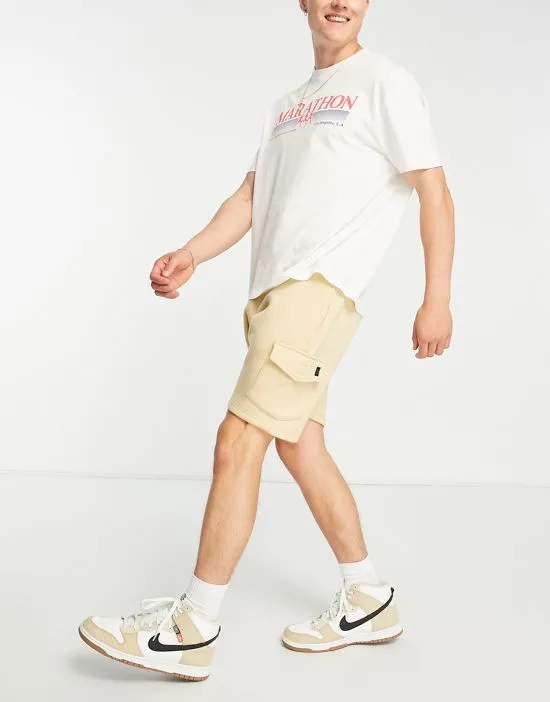 https://images.styletyx.com/images/cargo-pocket-jersey-shorts-in-stone-le-breve-13286322_1.webp