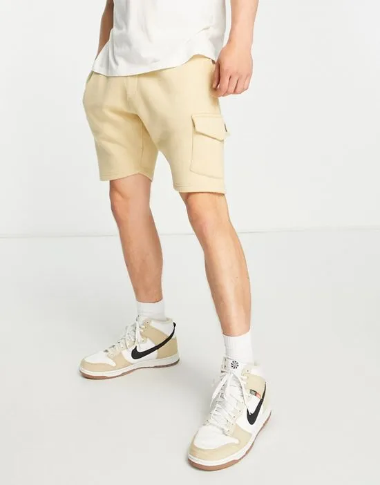 https://images.styletyx.com/images/cargo-pocket-jersey-shorts-in-stone-le-breve-13286322_3.webp