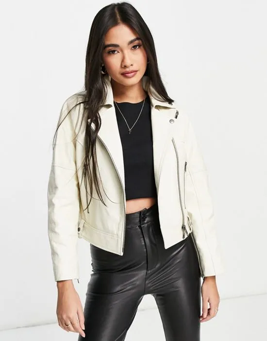 https://images.styletyx.com/images/charlie-drop-shoulder-leather-moto-jacket-in-eggshell-muubaa-13076520_1.webp