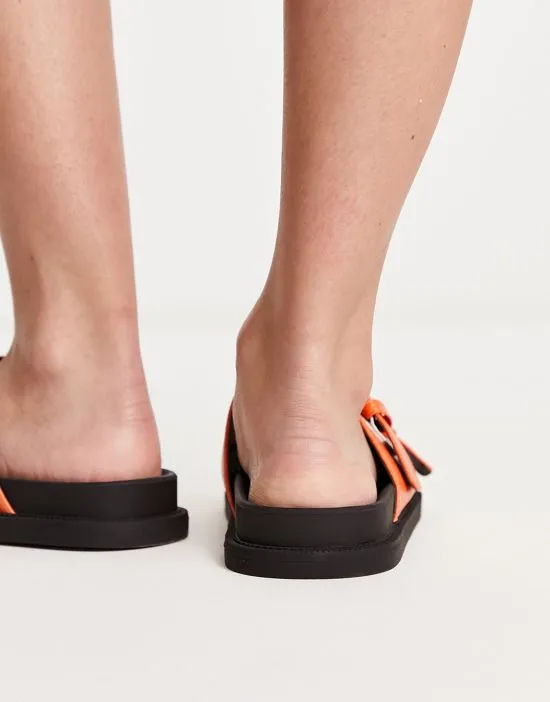 https://images.styletyx.com/images/chunky-double-buckle-footbed-slides-in-orange-london-rebel-wide-fit-13315879_4.webp