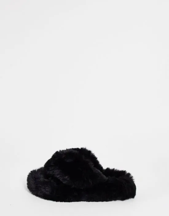 https://images.styletyx.com/images/chunky-fluffy-cross-over-slipper-in-black-loungeable-2765855_4.webp
