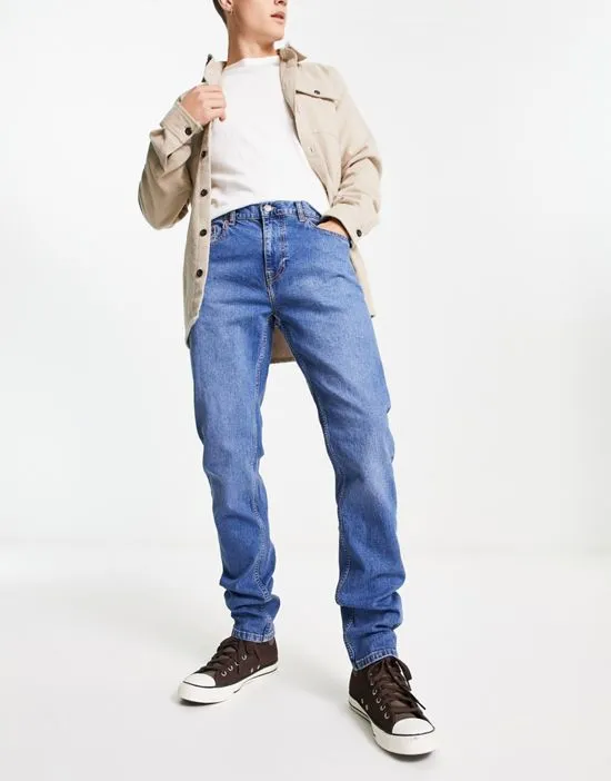 https://images.styletyx.com/images/clark-slim-fit-jeans-in-mid-wash-blue-dr-denim-3183506_1.webp