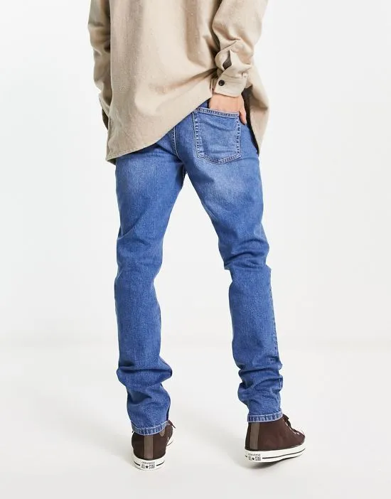 https://images.styletyx.com/images/clark-slim-fit-jeans-in-mid-wash-blue-dr-denim-3183506_2.webp