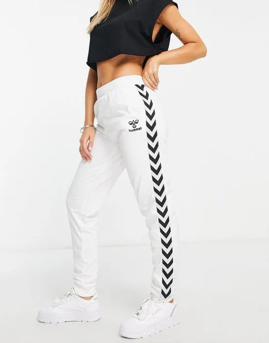 https://images.styletyx.com/images/classic-taped-track-pants-in-white-hummel-2833269_1.webp
