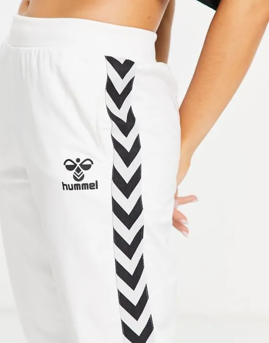https://images.styletyx.com/images/classic-taped-track-pants-in-white-hummel-2833269_2.webp