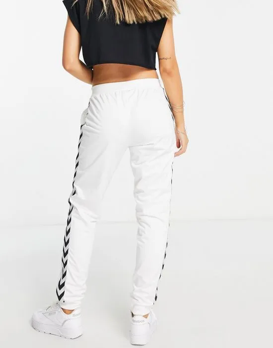 https://images.styletyx.com/images/classic-taped-track-pants-in-white-hummel-2833269_3.webp
