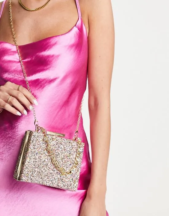 https://images.styletyx.com/images/clutch-bag-with-chunky-chain-grab-handle-in-pink-glitter-true-decadence-2343562_2.webp
