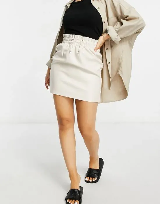 https://images.styletyx.com/images/coated-mini-skirt-in-cream-vero-moda-petite-13312750_4.webp