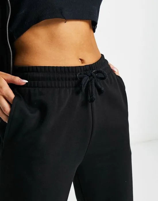 https://images.styletyx.com/images/collusion-oversized-branded-sweatpants-in-black-collusion-13000652_4.webp