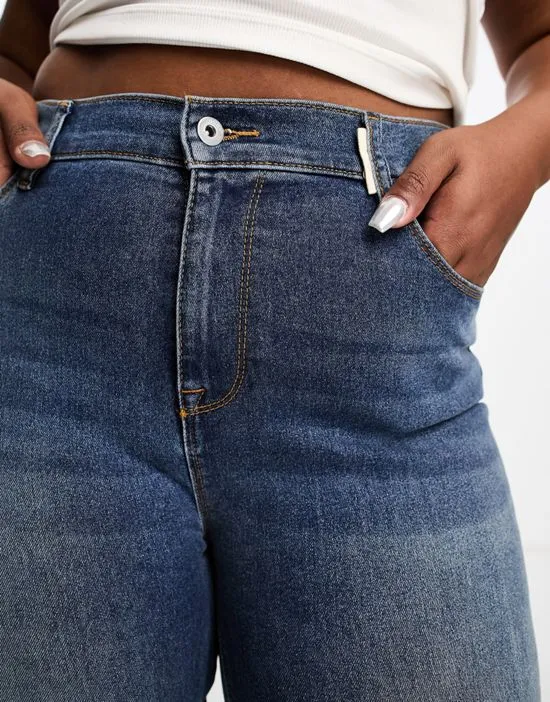 https://images.styletyx.com/images/collusion-plus-x001-high-waisted-skinny-jeans-in-mid-blue-collusion-2765920_4.webp