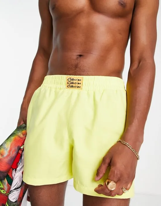 https://images.styletyx.com/images/collusion-swim-shorts-with-branded-label-in-yellow-collusion-2427224_3.webp