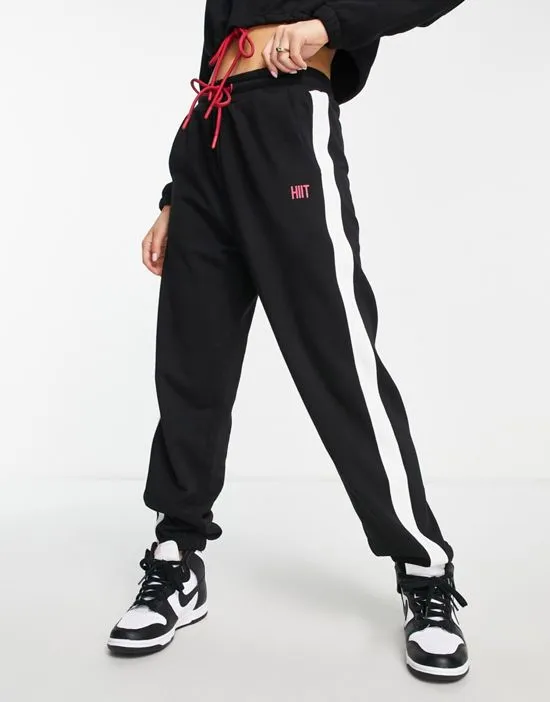 https://images.styletyx.com/images/color-block-joggers-in-black-hiit-3265311_1.webp
