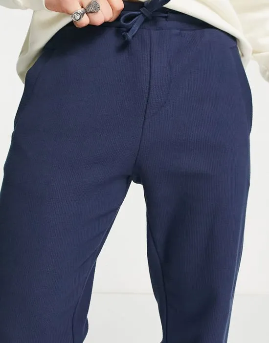https://images.styletyx.com/images/cotton-blend-jersey-slim-fit-sweatpants-in-navy-part-of-a-set-navy-selected-homme-1796873_4.webp