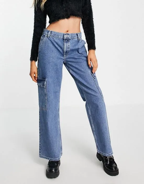https://images.styletyx.com/images/cotton-blend-low-rise-cargo-jean-in-mid-wash-blue-lblue-asos-design-1779251_1.webp