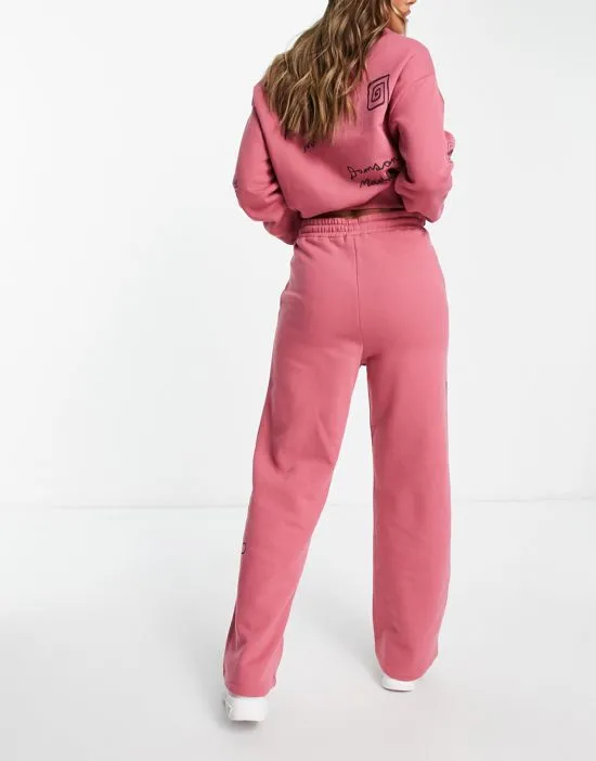 https://images.styletyx.com/images/cotton-doodle-sweatpants-in-washed-pink-part-of-a-set-damson-madder-3299707_2.webp