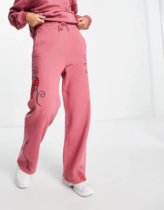 https://images.styletyx.com/images/cotton-doodle-sweatpants-in-washed-pink-part-of-a-set-damson-madder-3299707_4.webp