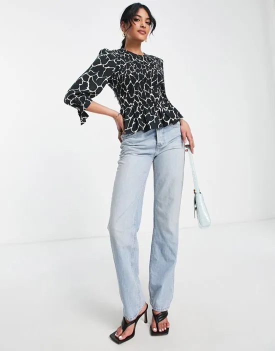 https://images.styletyx.com/images/cotton-smocked-blouse-in-animal-print-black-whistles-1886826_3.webp