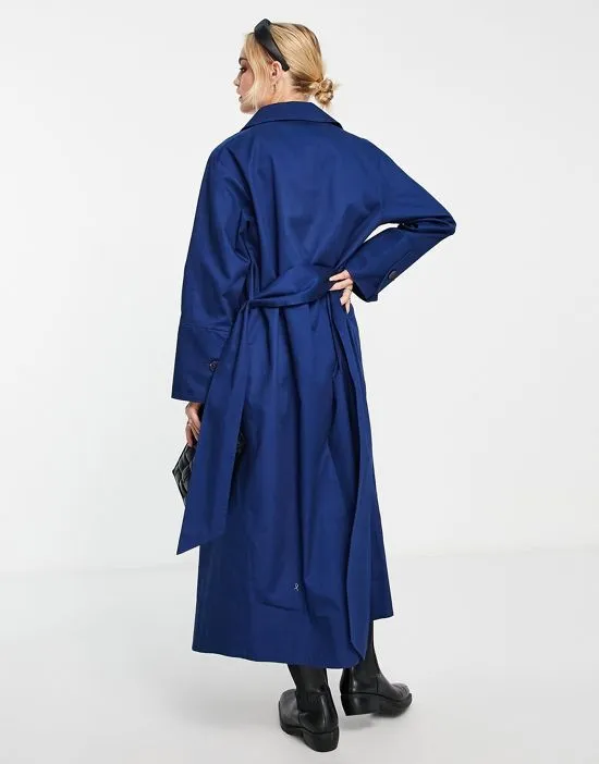 https://images.styletyx.com/images/cotton-trench-coat-with-buttons-in-blue-topshop-2194045_2.webp