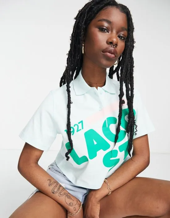 https://images.styletyx.com/images/crop-polo-top-in-mint-lacoste-1890230_3.webp