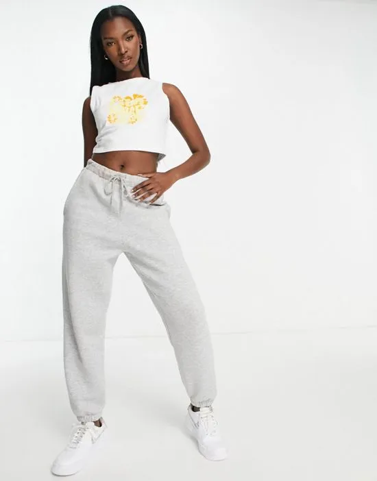 https://images.styletyx.com/images/crop-top-with-60s-print-in-white-and-yellow-fila-2531130_4.webp