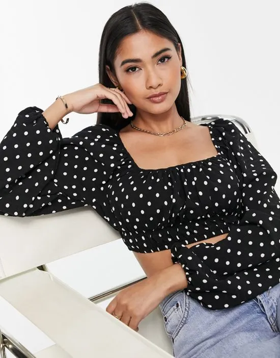 https://images.styletyx.com/images/cropped-puff-sleeve-blouse-in-polka-dot-lola-may-2491584_3.webp