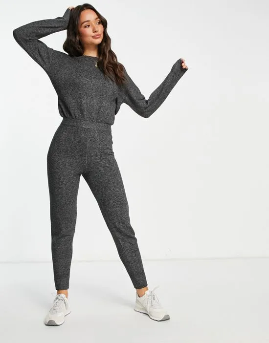 https://images.styletyx.com/images/cross-back-jumpsuit-in-charcoal-gray-m-lounge-2402646_4.webp