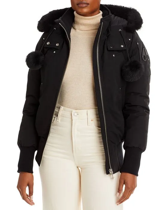 https://images.styletyx.com/images/debbie-shearling-trimmed-hooded-bomber-jacket-moose-knuckles-2468851_1.webp