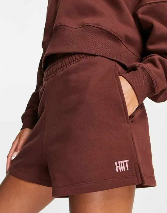 https://images.styletyx.com/images/dolphin-sweat-short-in-brown-hiit-2539588_1.webp