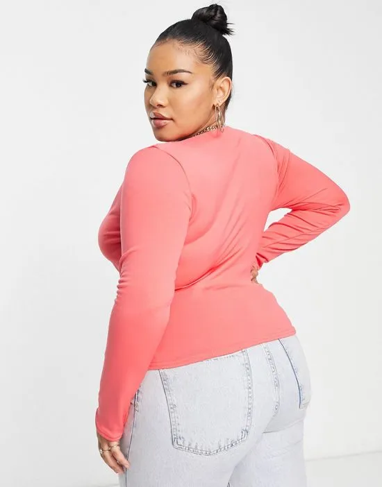 https://images.styletyx.com/images/double-layer-slinky-long-sleeve-crop-top-in-coral-public-desire-curve-1944894_3.webp
