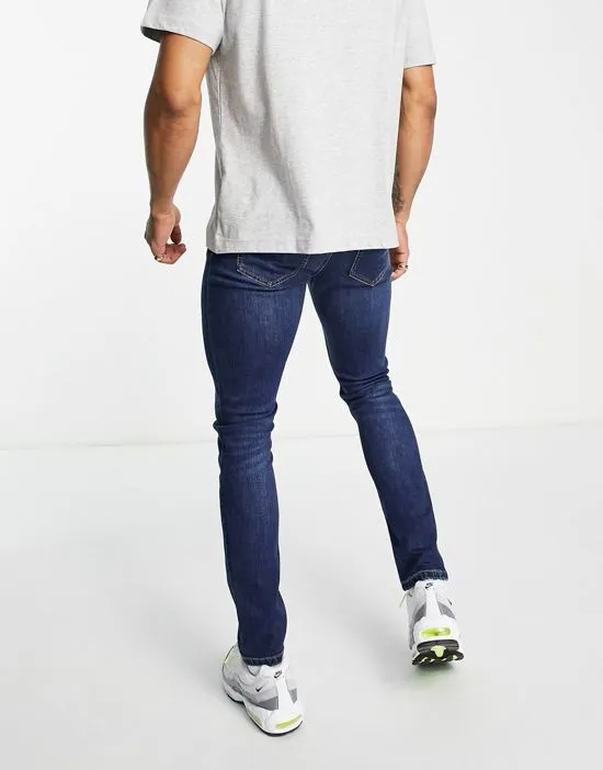 https://images.styletyx.com/images/drake-skinny-jeans-in-mid-wash-farah-13291756_2.webp