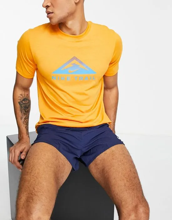 https://images.styletyx.com/images/dri-fit-trail-t-shirt-in-mustard-nike-2932961_3.webp