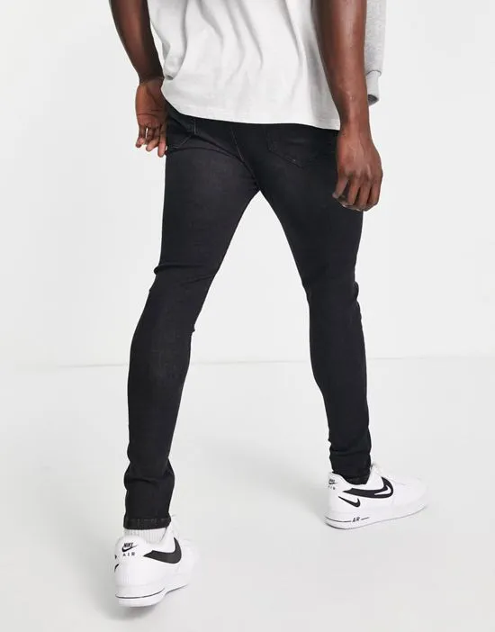 https://images.styletyx.com/images/dtt-carrot-fit-jeans-in-washed-black-don-t-think-twice-3112667_2.webp