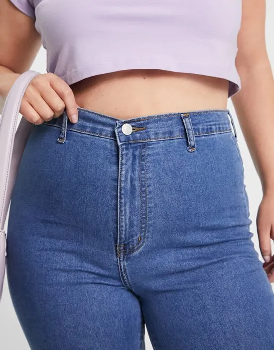 https://images.styletyx.com/images/dtt-plus-bianca-high-waisted-flare-disco-jeans-in-mid-blue-don-t-think-twice-plus-1964848_3.webp
