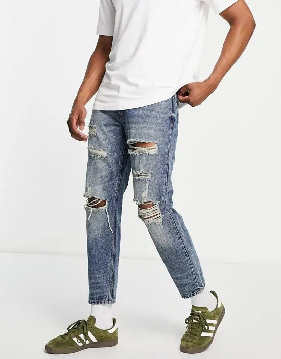 https://images.styletyx.com/images/dtt-rigid-cropped-tapered-fit-ripped-jeans-in-vintage-dark-blue-don-t-think-twice-2977126_3.webp