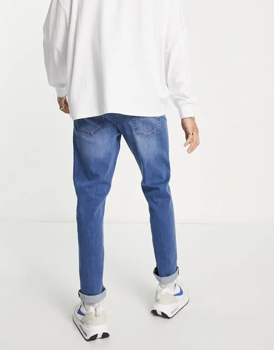 https://images.styletyx.com/images/dtt-slim-fit-jeans-in-light-blue-don-t-think-twice-2454219_4.webp